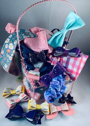 A basket of hair accessories in a multitude of colors and styles.